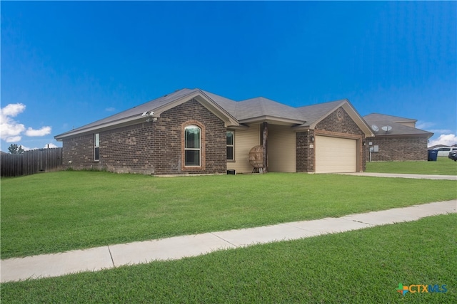 ranch-style home with a garage and a front lawn