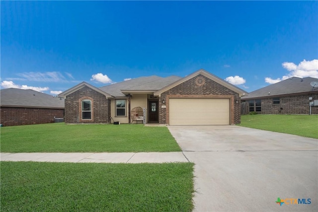 2520 Heartland Ave, Copperas Cove, TX 76522 - single story home with an attached garage, brick siding, and a front yard