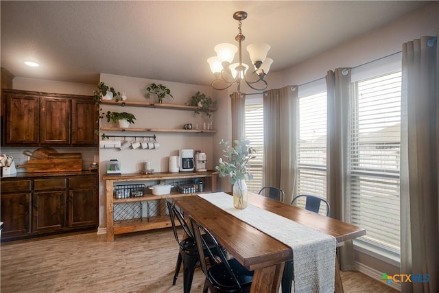 2520 Heartland Ave, Copperas Cove, TX 76522 - dining area with a chandelier and light wood-style floors