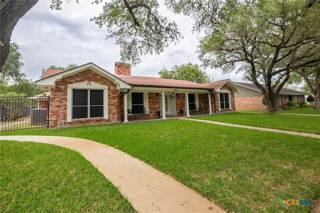 single story home with fence, a chimney, central AC, and a front lawn