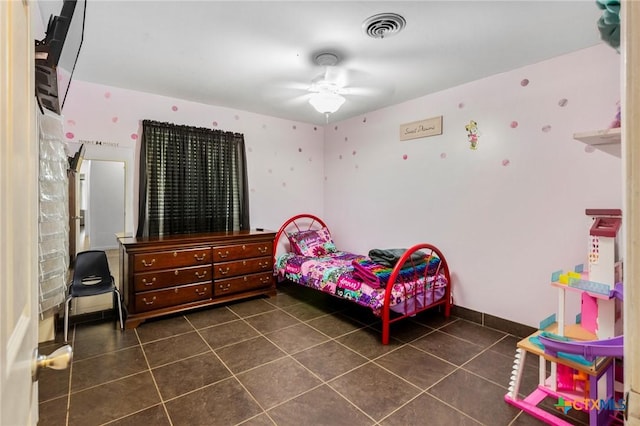 bedroom with visible vents and dark tile patterned flooring