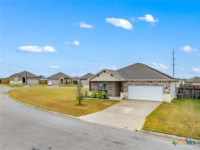 single story home featuring a garage, a front lawn, and central AC