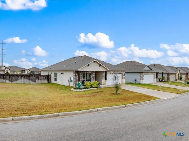 single story home featuring a garage and a front yard