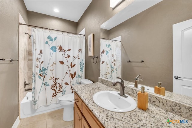 full bathroom featuring tile patterned floors, vanity, toilet, and shower / bath combo with shower curtain