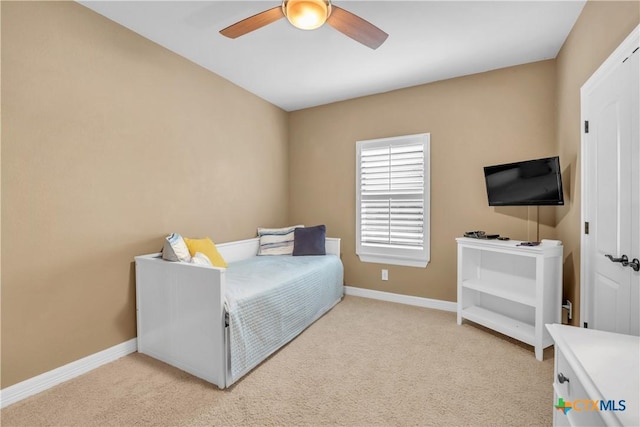 bedroom with light colored carpet and ceiling fan