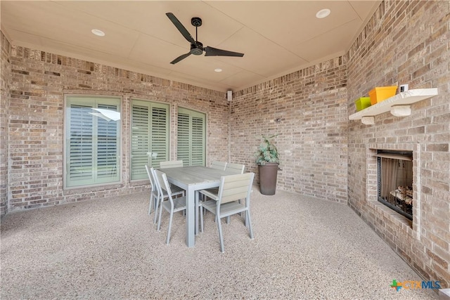 view of patio with an outdoor brick fireplace