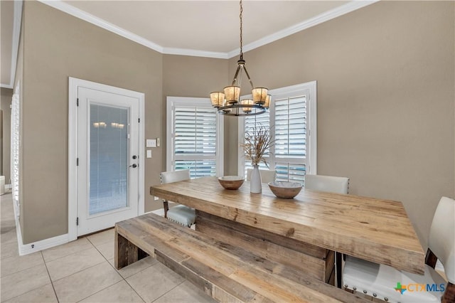 dining room with crown molding, light tile patterned flooring, and an inviting chandelier