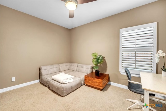 office area with light carpet and ceiling fan