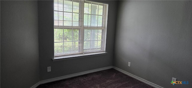 1805 Dickens Dr, Killeen, TX 76543 - unfurnished room with dark carpet and baseboards