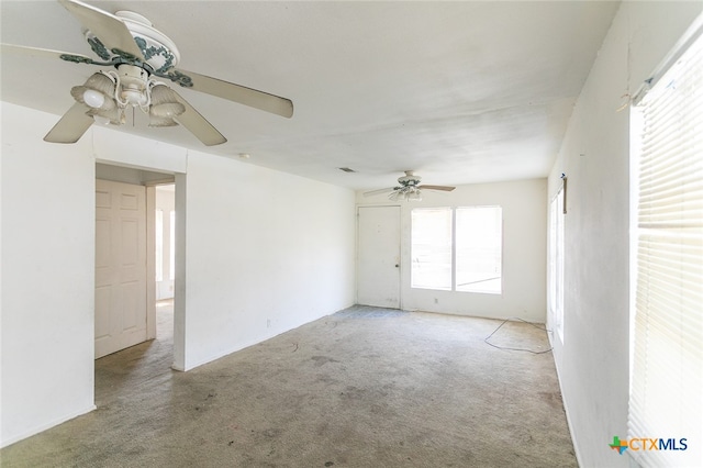 spare room with light carpet and ceiling fan