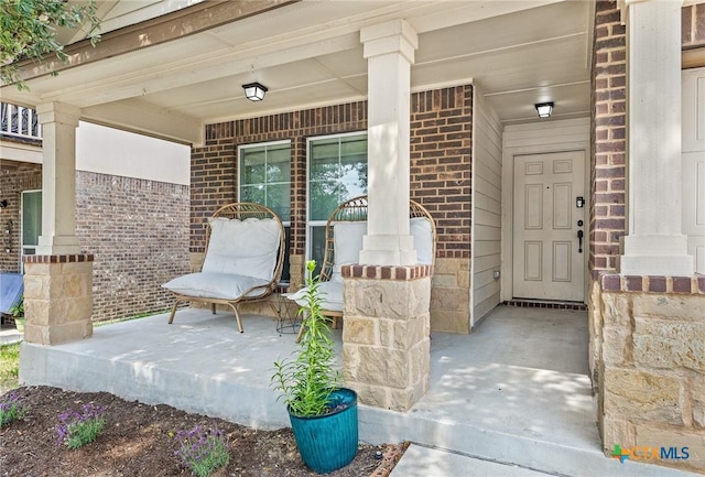 view of patio featuring a porch