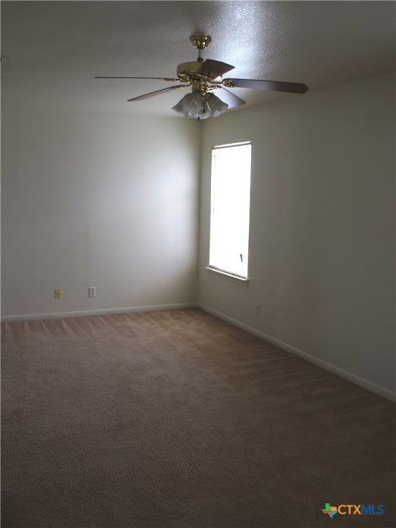 1402 Chips Dr, Killeen, TX 76549 - spare room with a ceiling fan, carpet floors, and baseboards