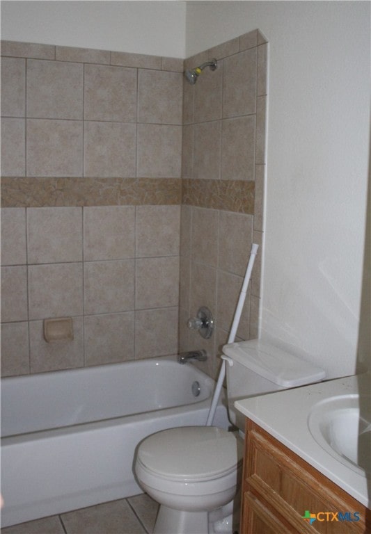 1402 Chips Dr, Killeen, TX 76549 - full bath featuring washtub / shower combination, toilet, tile patterned floors, and vanity