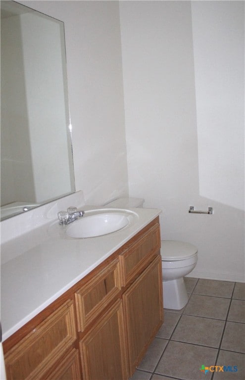 1402 Chips Dr, Killeen, TX 76549 - bathroom with vanity, tile patterned floors, and toilet