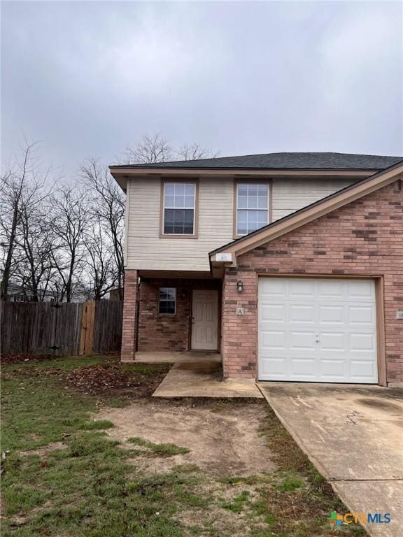 1402 Chips Dr, Killeen, TX 76549 - view of front of home with fence, brick siding, and concrete driveway