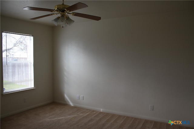 1402 Chips Dr, Killeen, TX 76549 - unfurnished room featuring healthy amount of natural light, light colored carpet, baseboards, and ceiling fan