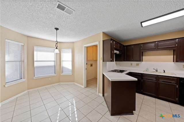 kitchen featuring light tile patterned floors, decorative light fixtures, dark brown cabinets, black appliances, and sink