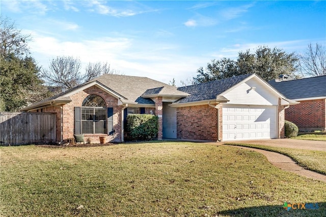 ranch-style house featuring a front yard and a garage