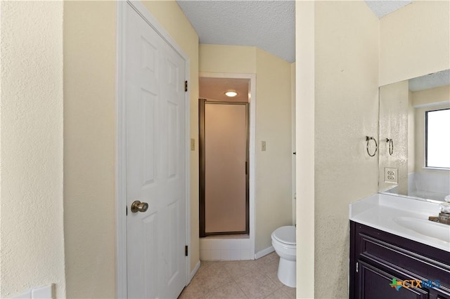 bathroom with a textured ceiling, an enclosed shower, tile patterned flooring, vanity, and toilet