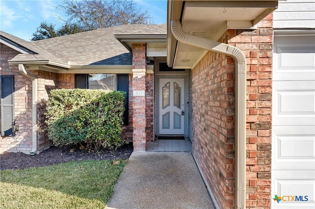 entrance to property featuring a garage