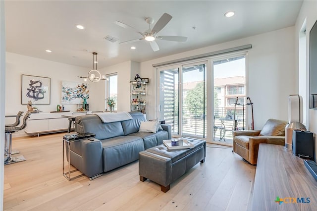 1905 Dutton Dr Unit A, San Marcos, TX 78666 - living room featuring light wood finished floors, a ceiling fan, and recessed lighting