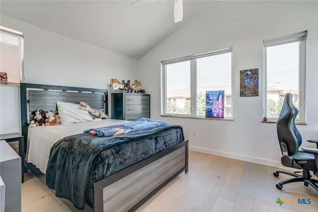 1905 Dutton Dr Unit A, San Marcos, TX 78666 - bedroom featuring light wood-style flooring, multiple windows, vaulted ceiling, baseboards, and an office area