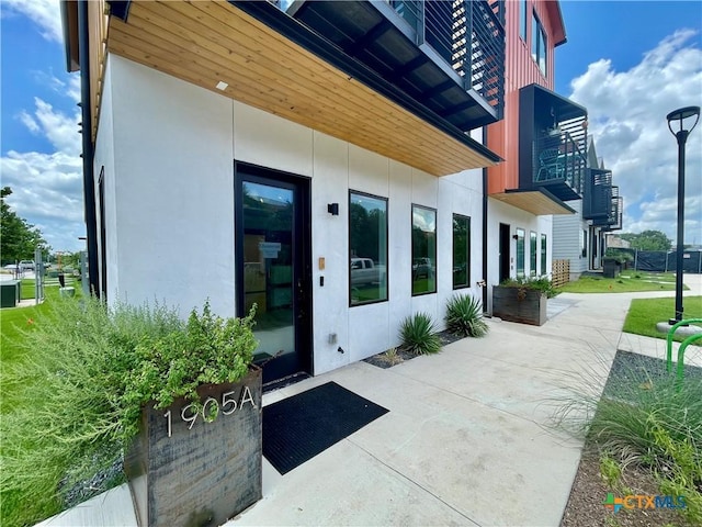 1905 Dutton Dr Unit A, San Marcos, TX 78666 - property entrance with stucco siding and a patio area