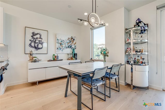 1905 Dutton Dr Unit A, San Marcos, TX 78666 - dining room featuring light wood-style flooring, a chandelier, and baseboards