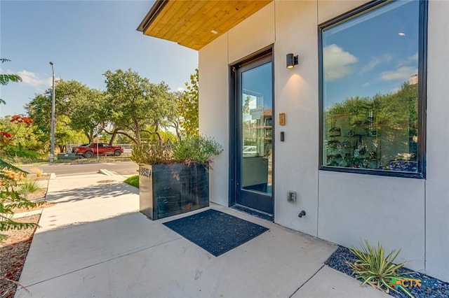 1905 Dutton Dr Unit A, San Marcos, TX 78666 - view of exterior entry featuring stucco siding