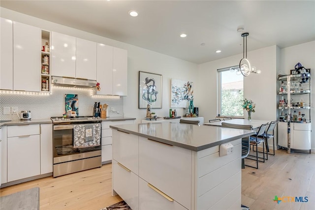 1905 Dutton Dr Unit A, San Marcos, TX 78666 - kitchen featuring electric stove, under cabinet range hood, modern cabinets, light wood finished floors, and recessed lighting