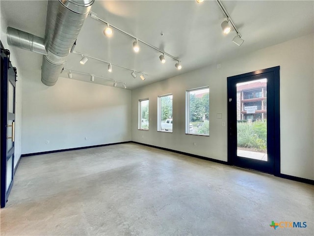 1905 Dutton Dr Unit A, San Marcos, TX 78666 - unfurnished room with track lighting, finished concrete floors, and baseboards