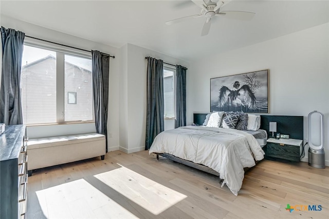 1905 Dutton Dr Unit A, San Marcos, TX 78666 - bedroom featuring multiple windows, light wood finished floors, baseboards, and a ceiling fan