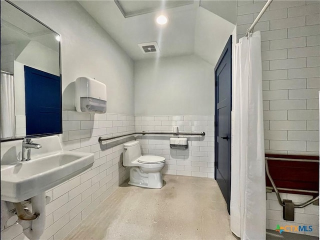 1905 Dutton Dr Unit A, San Marcos, TX 78666 - full bath featuring tile walls, toilet, a wainscoted wall, and a shower with curtain