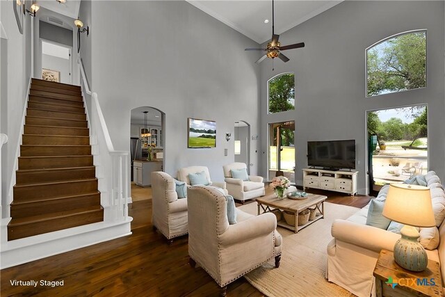 172 River Chase Dr, New Braunfels, TX 78132 - living room with a high ceiling, wood finished floors, ornamental molding, a ceiling fan, and stairs