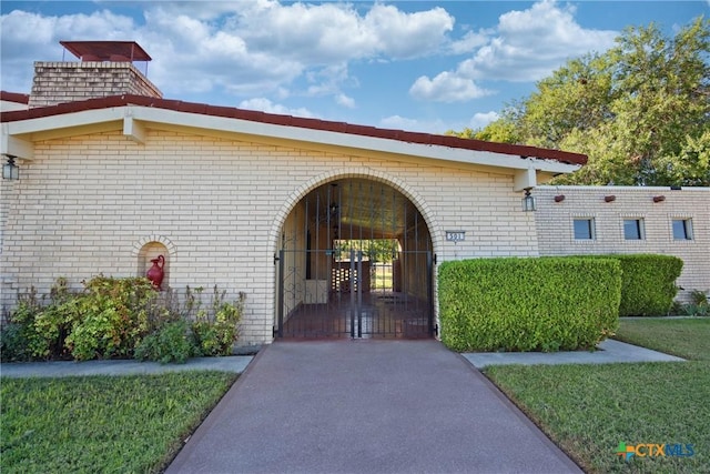 property entrance with a yard