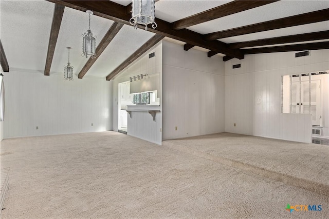 unfurnished living room with light colored carpet, lofted ceiling with beams, and wooden walls