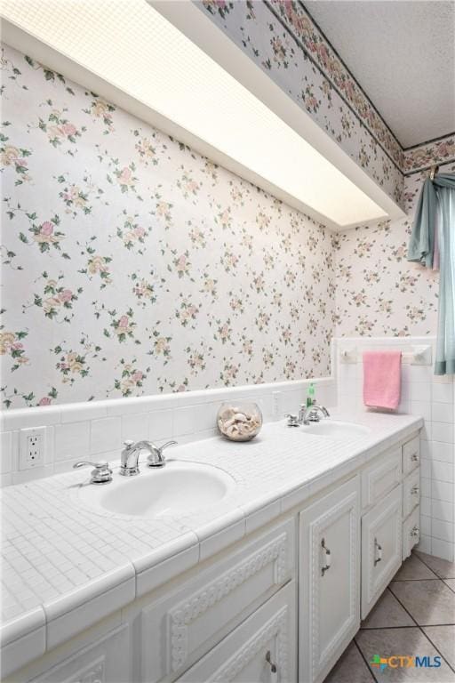 bathroom featuring tile patterned floors and vanity