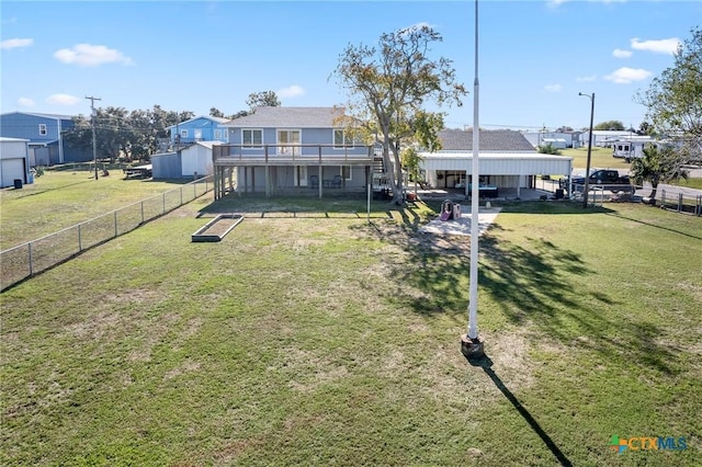 exterior space featuring a lawn and fence