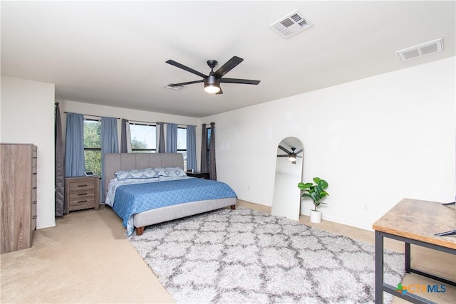 bedroom featuring light colored carpet and ceiling fan