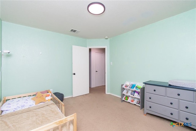 bedroom with light colored carpet