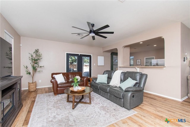 living room with hardwood / wood-style floors and ceiling fan