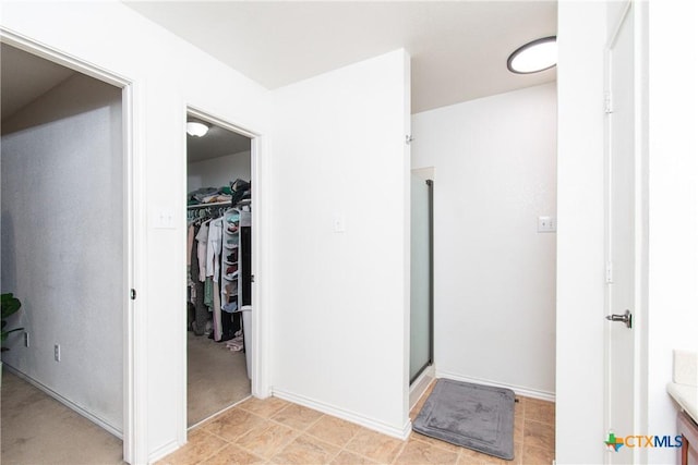 bathroom featuring vanity and an enclosed shower