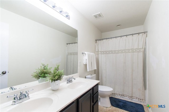 full bathroom featuring shower / bathtub combination with curtain, vanity, and toilet