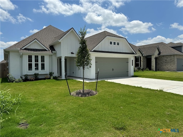 view of front of house with a garage and a front yard