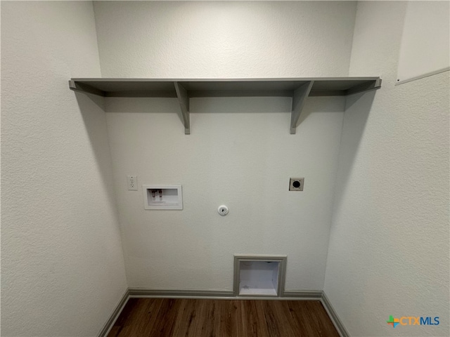 laundry room featuring hardwood / wood-style floors, washer hookup, electric dryer hookup, and hookup for a gas dryer