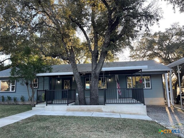 view of vehicle parking featuring a carport