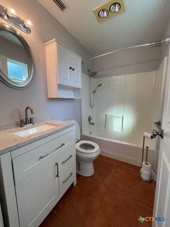 131 Oak Springs Dr, Canyon Lake, TX 78133 - bathroom featuring vanity, visible vents, tile patterned flooring, bathing tub / shower combination, and toilet