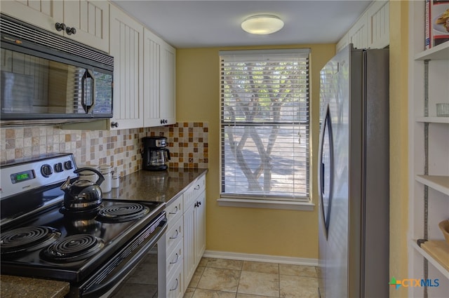 kitchen with white cabinetry, appliances with stainless steel finishes, and tasteful backsplash