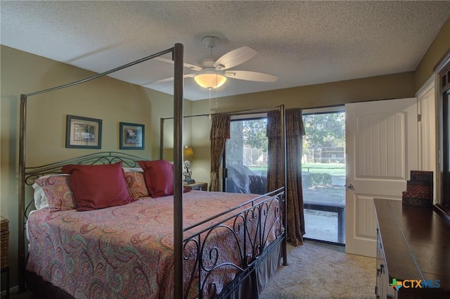 bedroom featuring ceiling fan, light colored carpet, access to outside, and a textured ceiling