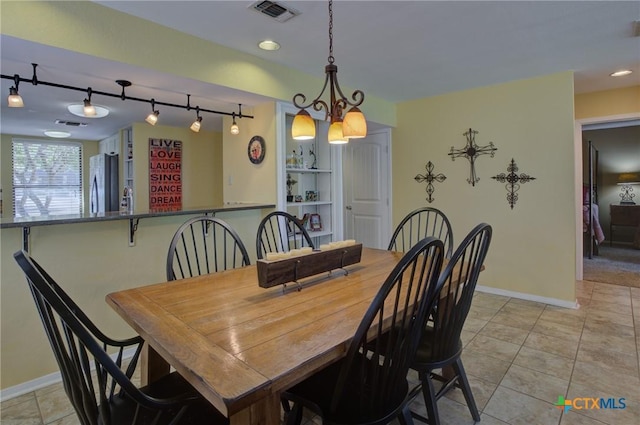 view of tiled dining space